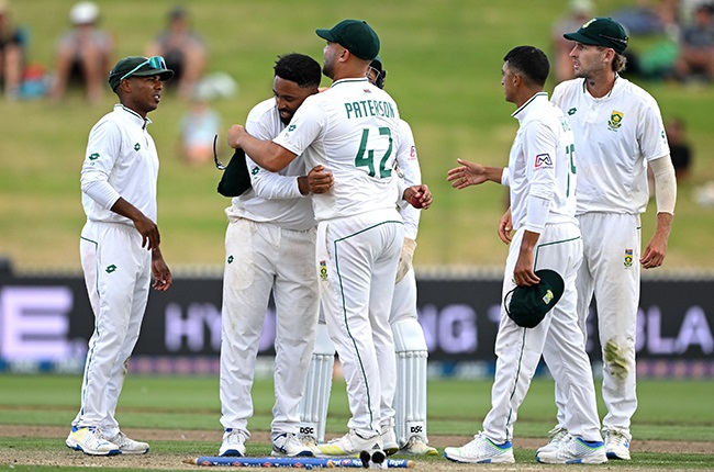 The Proteas' two Danes, Piedt and Paterson, hug each other following another New Zealand wicket in the second Test in Hamilton. (Photo by Hannah Peters/Getty Images)