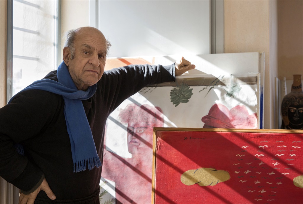 Greek contemporary artist Alekos Fassianos poses with his artworks in his house in Athens. Greek artist Alekos Fassianos, whose work drew on his country's mythology and folklore, died on January 16, 2022 at the age of 86, his daughter told AFP. (Louisa Nikolaidou/ AFP)