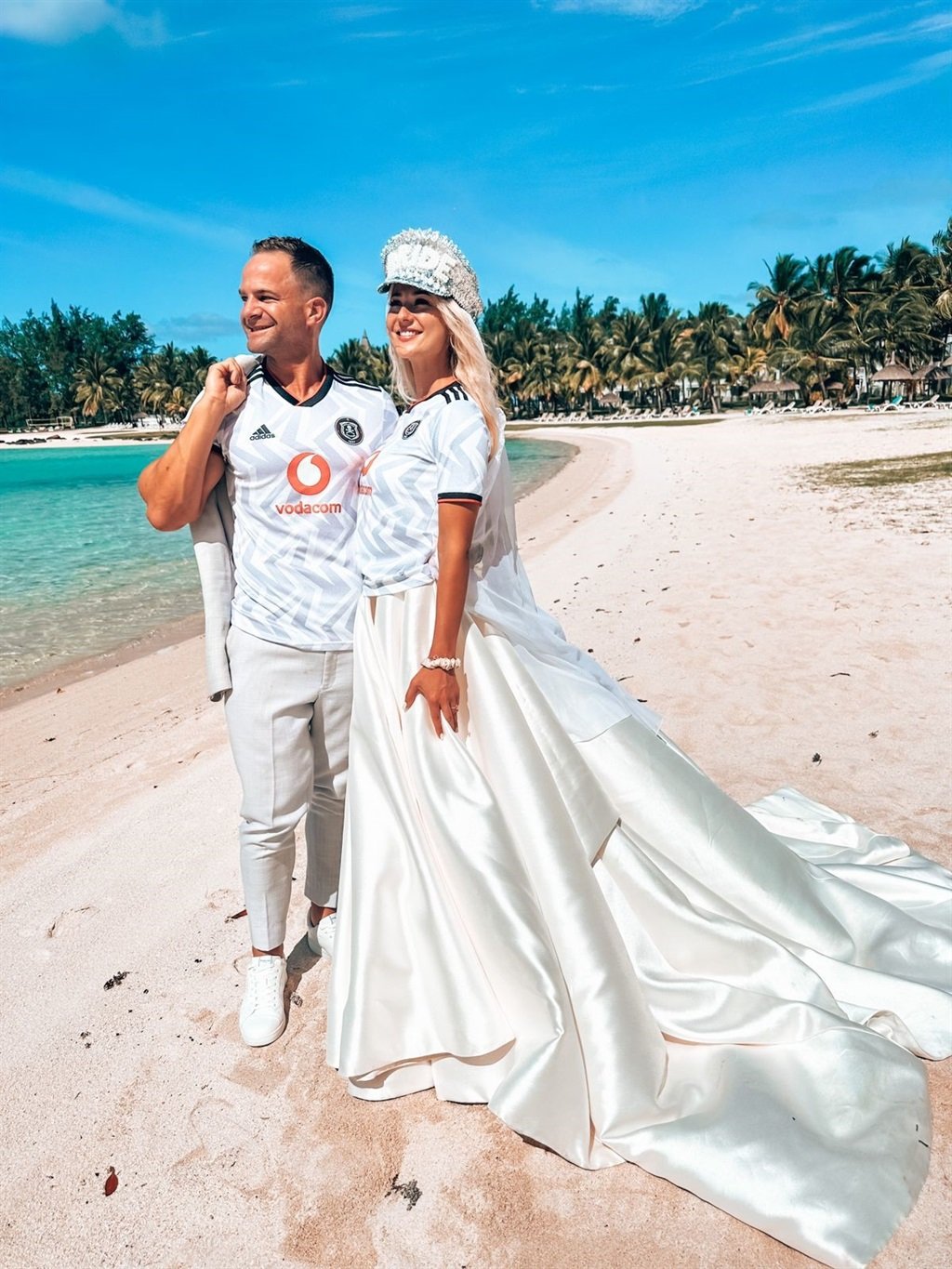 A couple that supports Orlando Pirates wore their away jerseys in their wedding photos.