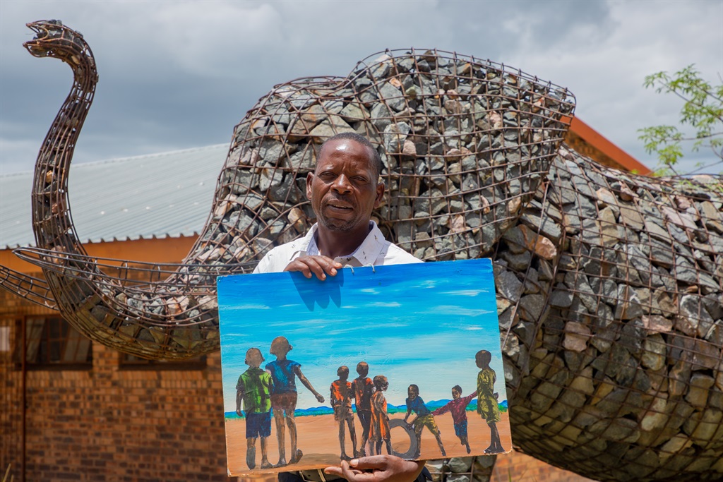Art teacher Walter Sibuyi, standing next to a wire figure elephant image he built at Shobiyana Senior Secondary School in Acornhoek. Photo by Oris Mnisi 