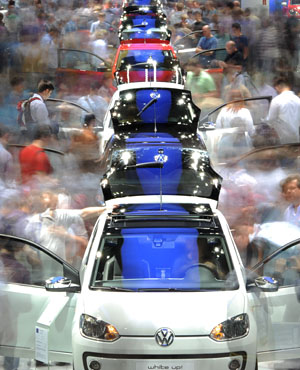Cars on an assembly line. (AFP)