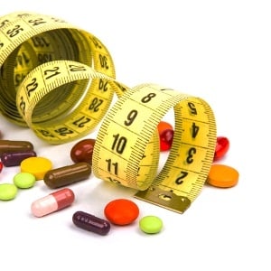Measuring tape and diet pills from Shutterstock