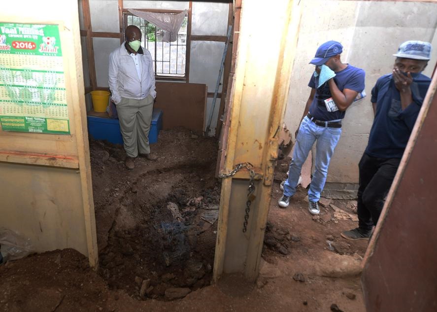 GRISLY FIND: The shallow grave in the house where the dead gogo was found. Photo by Trevor Kunene