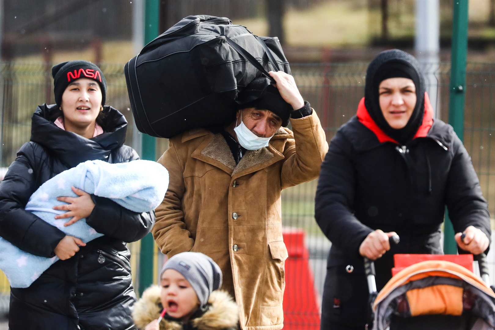 People fleeing from Ukraine are seen after crossing Ukrainian-Polish border. Beata Zawrzel/NurPhoto via Getty Images