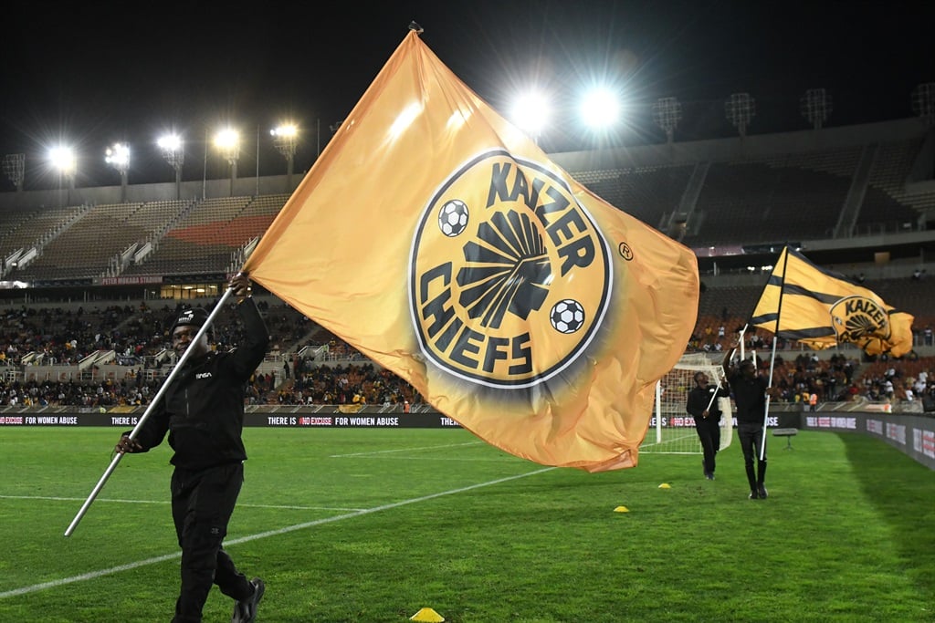 POLOKWANE, SOUTH AFRICA - APRIL 27: Supporters wave Kaizer Chiefs flag during the DStv Premiership match between Kaizer Chiefs and  SuperSport United at Peter Mokaba Stadium on April 27, 2024 in Polokwane, South Africa. (Photo by Philip Maeta/Gallo Images)