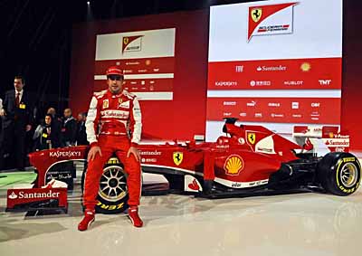 <b>NEW FERRARI FOR FERNANDO:</b> Ferrari Formula 1 driver Fernando Alonso with the 2013 F138 race car at its unveiling in Maranello, Italy. <i>Image: AFP</i>