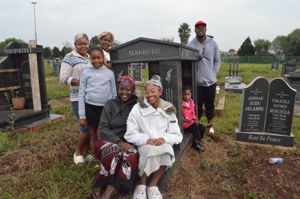 Bongani Makhubu and his family visited the grave of their late mum at Schoeman Cemetery. Photo by Happy Mnguni

 