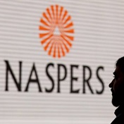 Naspers stable's shares slip after profit warning