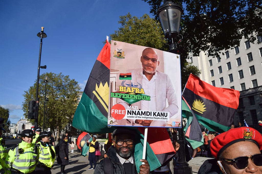 A protester holds a picture of Nnamdi Kanu during demonstrations for an independence referendum for Biafra and the release of separatist leader.