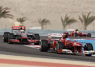<b>TROUBLE BREWING:</b> Mercedes' Lewis Hamilton, Ferrari's Felipe Massa and (behind) Fernando Alonso during the 2013 Bahrain F1 GP. Alonso was to suffer with a failed rear wing later in the race. <i>Image: AFP</i>