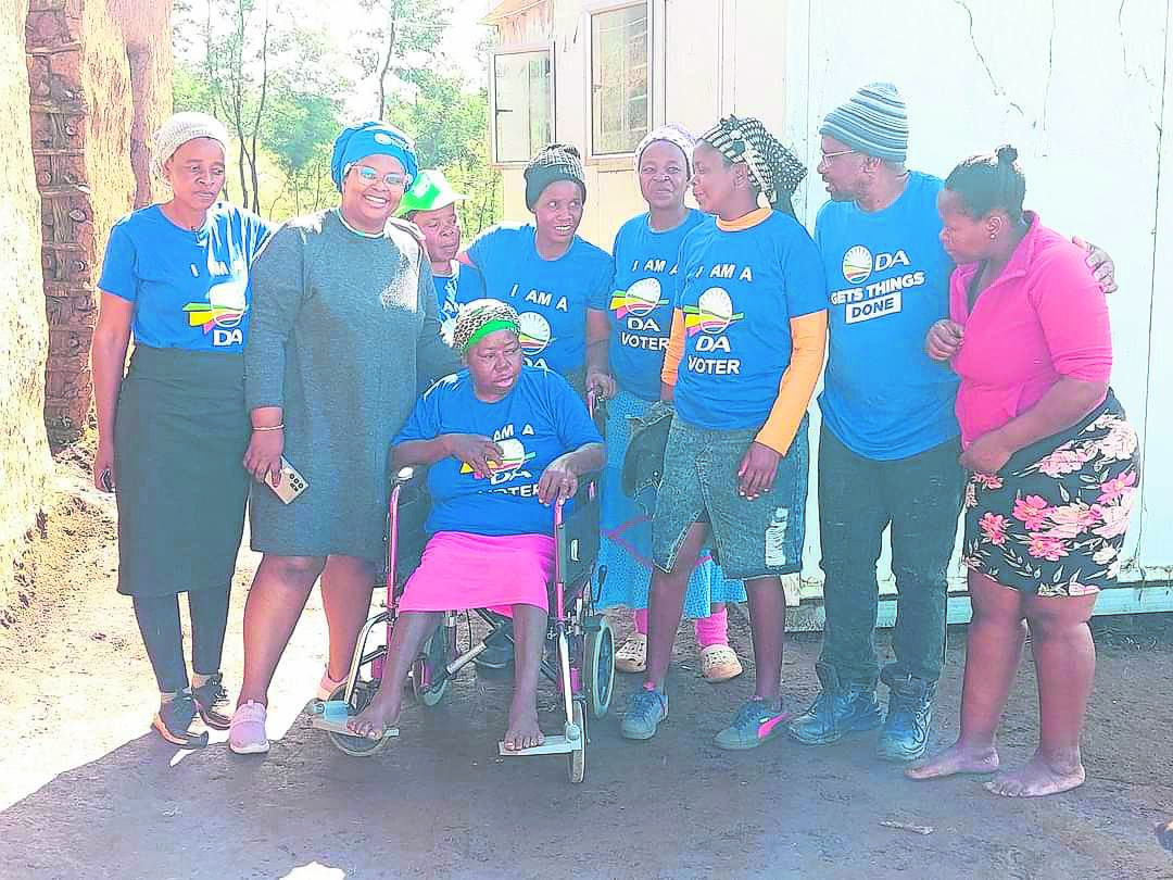DAWN Eastern Cape chairperson Nomvano Zibonda, second from left, together with members of the organization during their visit to Nomhle Mmiwa whom they donated a wheelchair. Far right is Mmiwas daughter Nobuhle.                                    