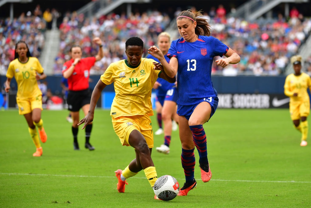 CHICAGO, ILLINOIS - SEPTEMBER 24: Alex Morgan #13 of the United States battles for the ball with Tiisetso Makhubela #14 of South Africa during the first half at Soldier Field on September 24, 2023 in Chicago, Illinois. (Photo by Jane Gershovich/ISI Photos/USSF/Getty Images for USSF)