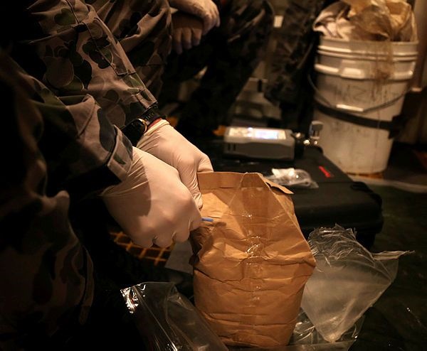 Over 118 kilograms of heroin was confiscated by HMAS Melbourne while on operations in the Indian Ocean. After being seized the illegal narcotics were transferred to HMAS Melbourne for analysis and disposal at sea. 