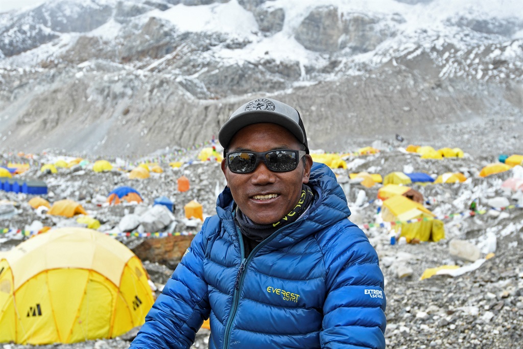 (FILES) In this file photo taken on May 2, 2021, Nepal's mountaineer Kami Rita Sherpa poses for a picture during an interview with AFP at the Everest base camp in the Mount Everest region of Solukhumbu district.