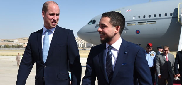 Prince William is greeted by the Crown Prince Hussein of Jordan after arriving at Marka Airport. (Photo: Getty Images)