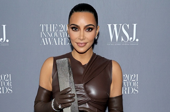 Kim Kardashian West poses with an award during the WSJ. Magazine 2021 Innovator Awards.