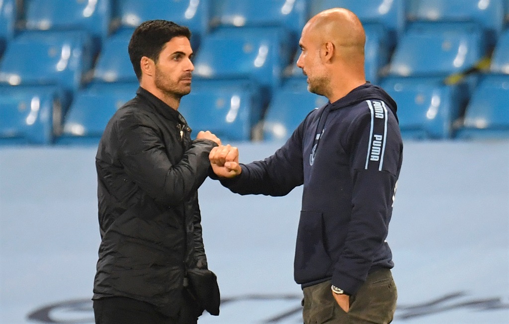 MANCHESTER, ENGLAND - JUNE 17: Mikel Arteta, Manager of Arsenal and Pep Guardiola, Manager of Manchester City interact at full-time after the Premier League match between Manchester City and Arsenal FC at Etihad Stadium on June 17, 2020 in Manchester, United Kingdom. (Photo by Peter Powell/Pool via Getty Images)