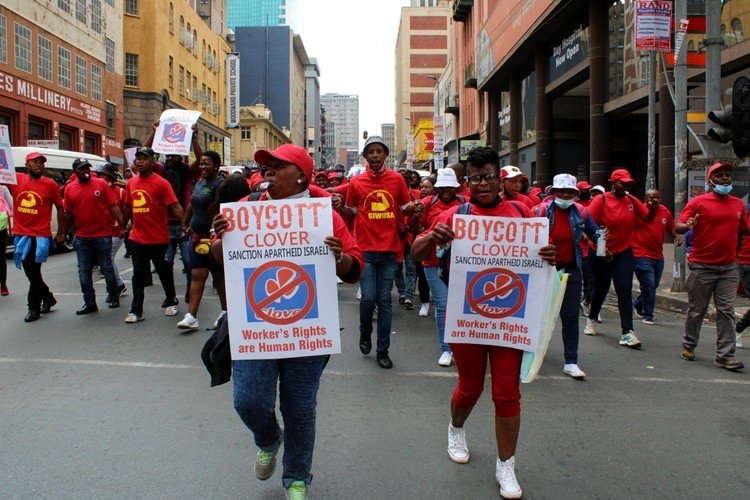 Clover workers, who have been on strike since last November, marched through Johannesburg. 