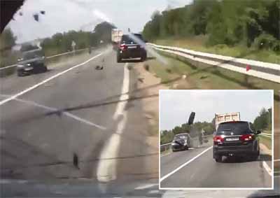 <b>MOMENT OF IMPACT:</B> A video captures the moment two vehicles are damaged by wayward tyres from a truck in Russia. <I>Image: Youtube</i>