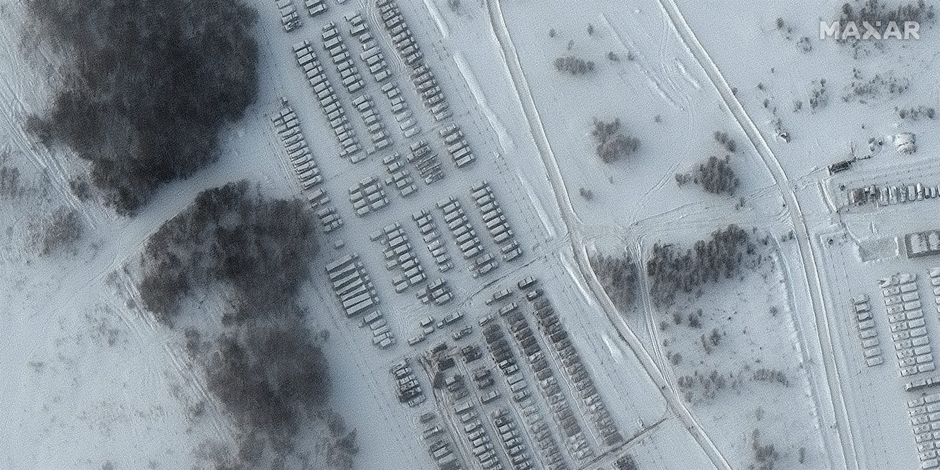 View of tanks, artillery, and tents in Yelyna, Russia, which is about 80 miles east of Belarus, on Jan. 19, 2022. Satellite image ©2022 Maxar Technologies