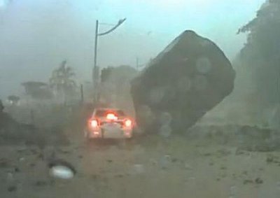 <b>LUCKY ESCAPE:</b> A driver narrowly avoided being flattened as a landslide in Taiwan caused a huge boulder to smash into the road. <i>Image: YouTube</i>
