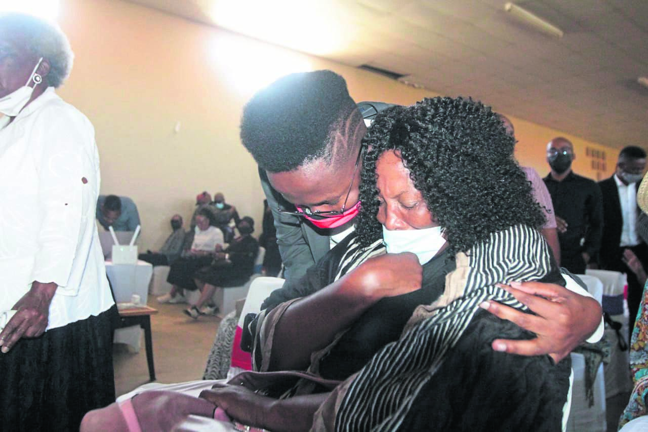 Sam’s mum being consoled by his close friend and mentor, Tutu Kgobane at the funeral. ­     Photo by Raymond Morare