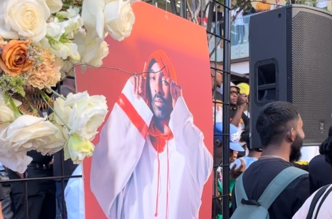 A picture of Riky Rick placed right next to the dance floor where his music was blasted for cotton eaters to enjoy