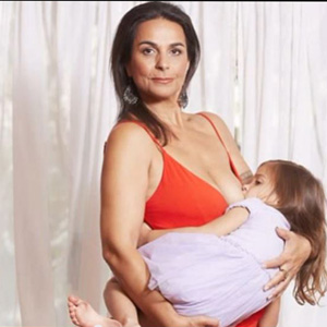 Mother Breast Feeding Teen Daughter