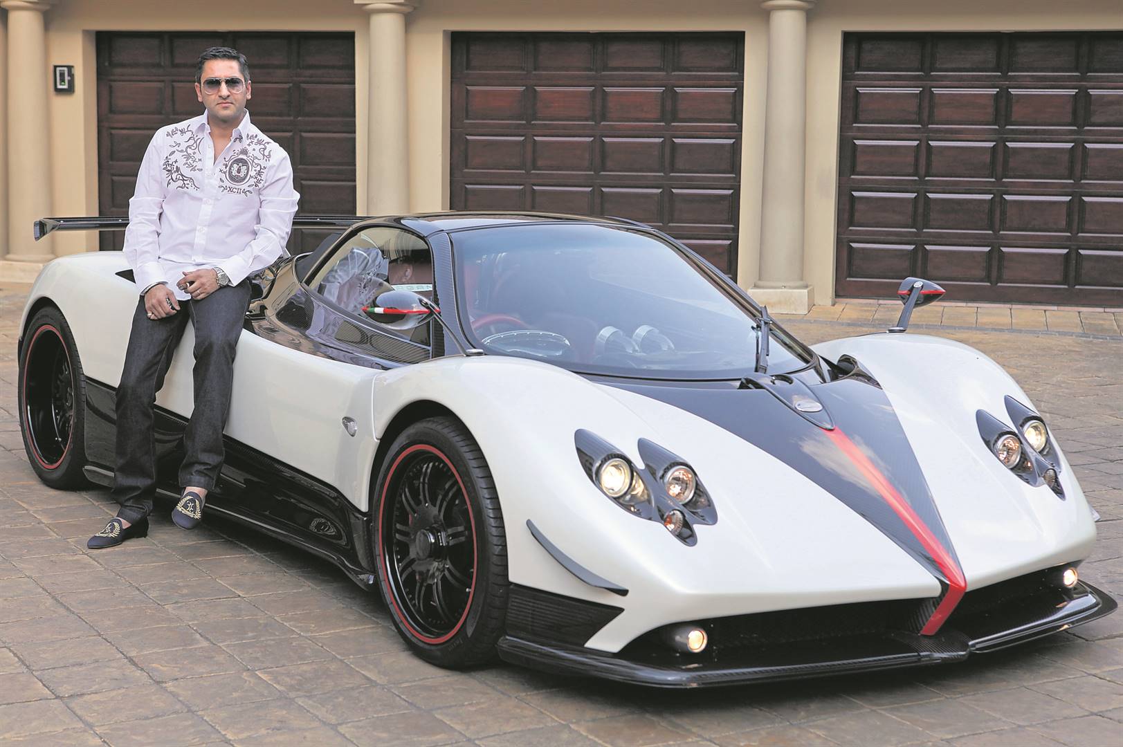  Controversial businessperson Zunaid Moti with his limited edition R20 million Pagani Zonda at his home in Johannesburg, a few years ago. He founded luxury car dealership Future Exotics Lifestyle Emporium Photo:Gallo images