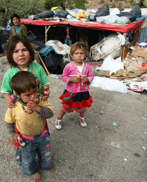 Syrian refugee children stand near their makeshift tents. (Adem Altan, AFP)