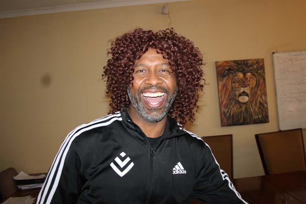 Lucas 'Rhoo' Radebe was presented with a wig after donating food parcels at a kasi school. 