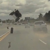 WATCH | Car goes airborne and flips over on California highway after tyre pops off bakkie