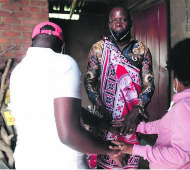 BACK IN EACH OTHER’S ARMS: This couple is living together again after the wife was caught by his husband with another man in bed in Mamelodi. Traditional healer Hassan Mulongo gave the man muthi to catch his wife red handed with another man.        Photo by       Raymond Morare