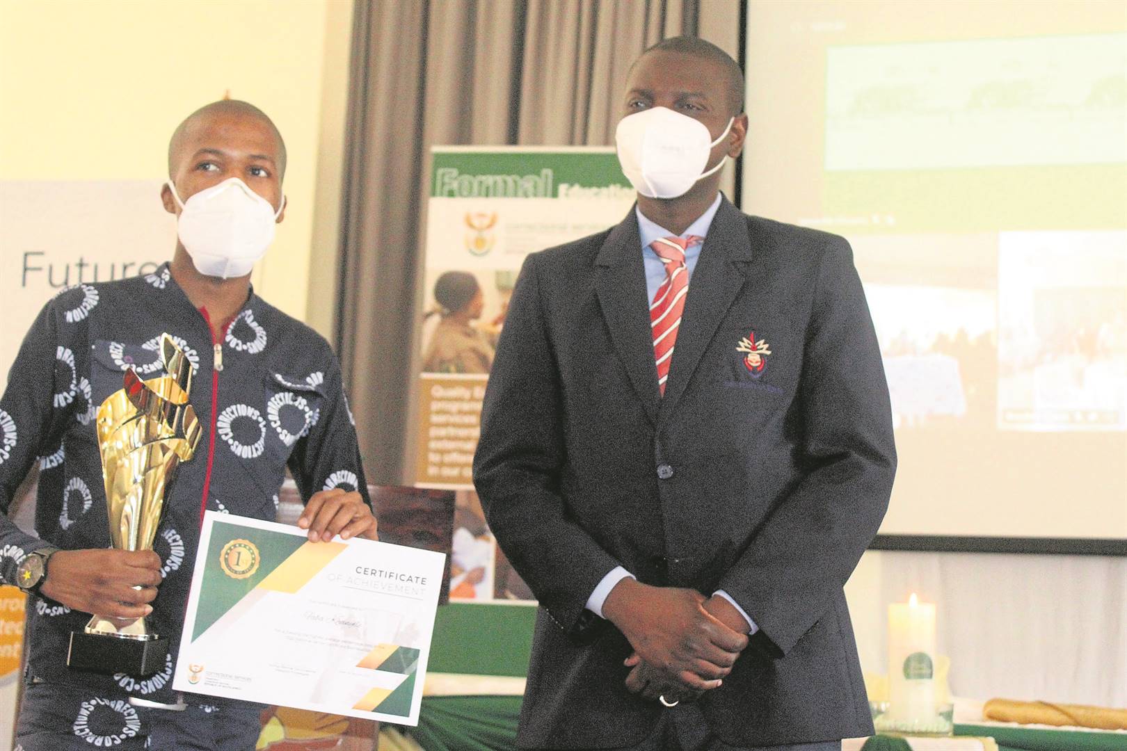 Overall top prison learner Khanyile Faba receives his certificate from Minister Ronald Lamola.       Photo by                 Bulelwa Ginindza