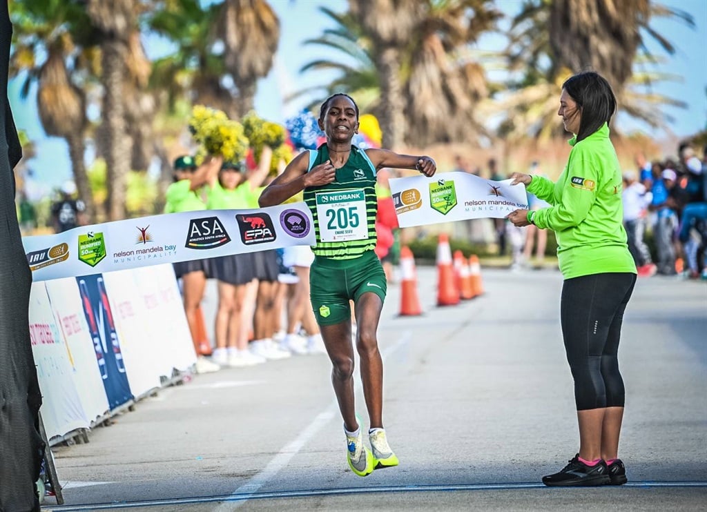 Emane Seifu Hayile crossed the finish line with a record time of 3:00:30.