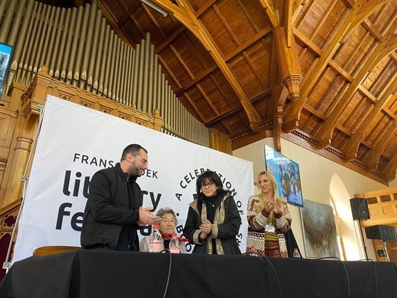 Ella Blumenthal (centre) received a standing ovation at the Franschhoek Literary Festival after the launch of her book I Am Ella, written by Joanne Jowell (far right). 