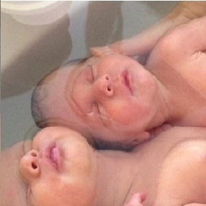 Twin newborns enjoying Thalasso bath therapy.