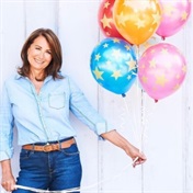 Carole Middleton blows out the candles on her party business