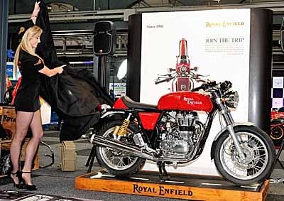 <b>CURE FOR A CRISIS:</b> Miss uShaka 2103, Chloe Stone, with Brice Bizzel, MD of Royal Enfield South Africa, and the Royal Enfield Continental GT at its unveiling at the 2013 Durban auto show. <i>Image: ALWYN VILJOEN</i>