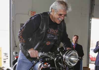 <B>HAPPY REUNION:</B> Donald DeVault was ecstatic when he was reunited with his 1953 Triumph Tiger 100. It was stolen 46 years ago from his backyard. <I>Image: AP</I> 