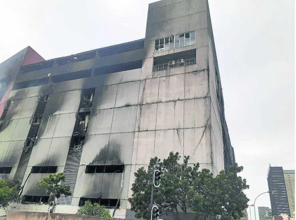 With cracks forming across the building, firefighters have been advised not to enter the Xinhua Distribution Centre as there are fears it could collapse.