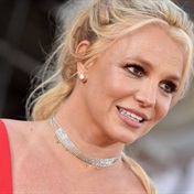 Britney Spears reveals she'll be wearing a Donatella Versace design when she walks down the aisle
