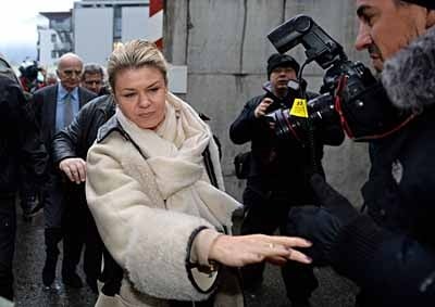 <b>'EXCUSE ME, PLEASE!' </b> Michael Schumacher's wife Corinna arrives a his hospital in France - she wants the media to stay away. <i>Image: AFP</i>
