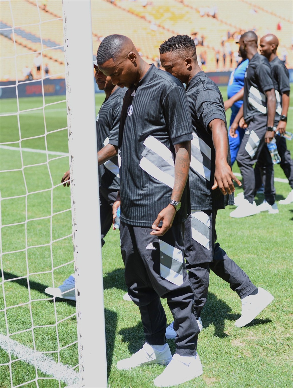 Orlando Pirates wearing their wavy pre match outfi