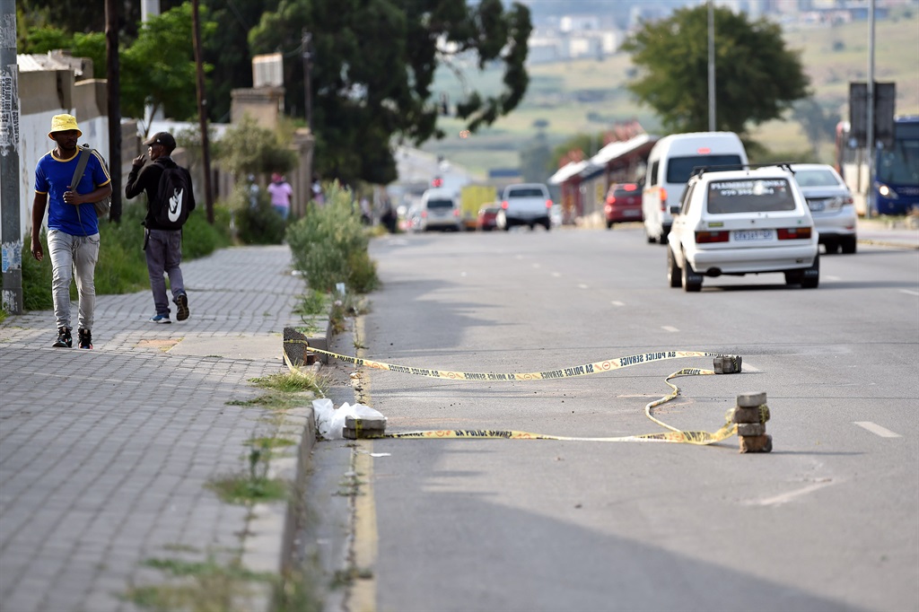 Scene where the robber was allegedly killed by the mob. Photo by Christopher Moagi 