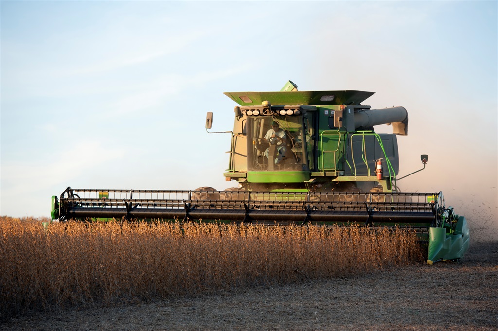 Combine harvests rows of soybeans. (Image: Getty)