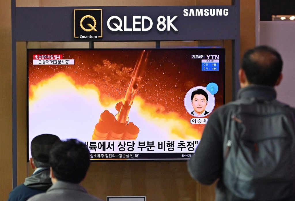 People watching footage of a North Korean missile 