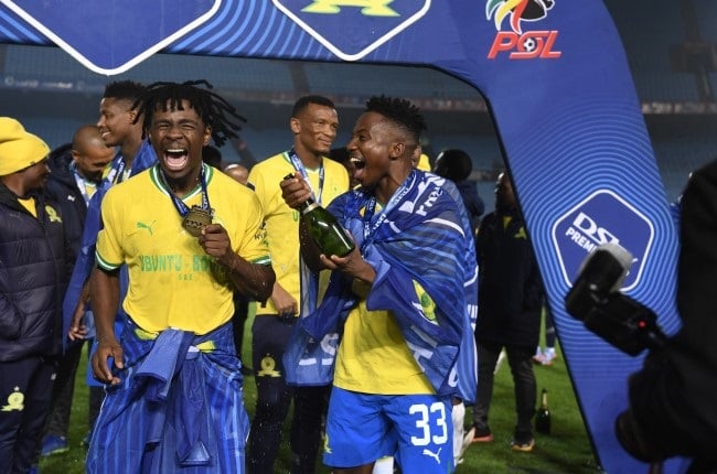 Terrence Mashego, who is pictured with Cassius Mailula, says because of Mamelodi Sundowns' hectic schedule this year he has seen little of his eight-month-old son. 
This is the heavy price the players and their families have paid for Sundowns' success. 
(Lefty Shivambu/Gallo Images)