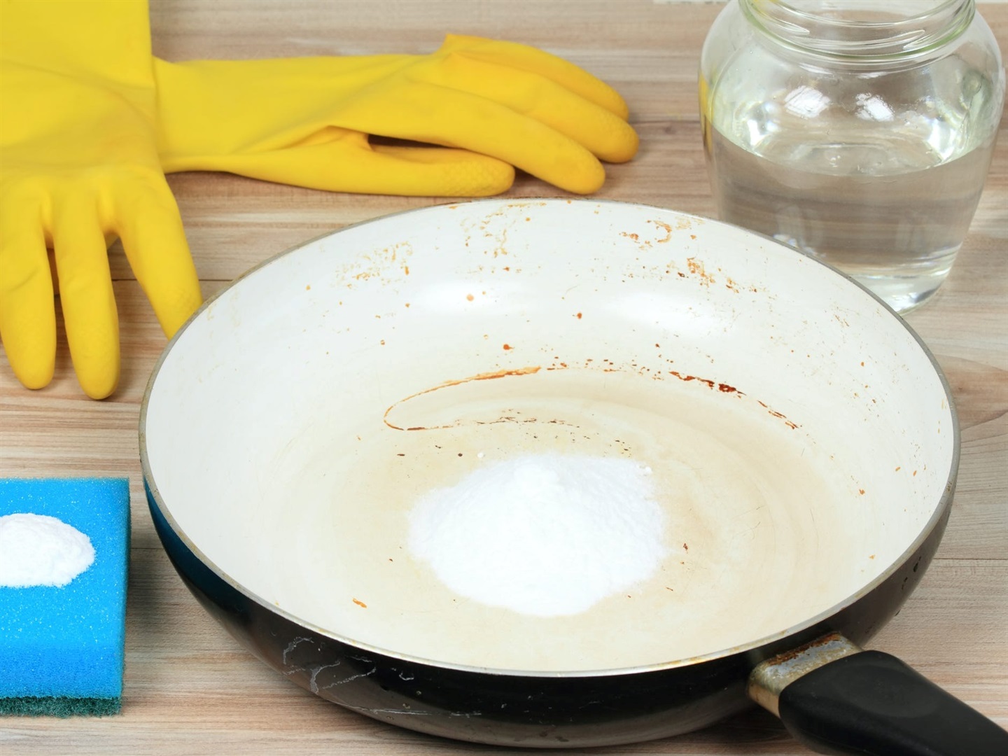 Baking soda serves as a scouring agent to scrub away stuck-on debris. svehlik/Getty Images