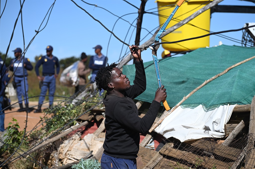 City Power destroyed illegal connections at Motsoaledi informal settlement on Wednesday. Photo by Morapedi Mashashe